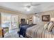Bright bedroom with king bed, private balcony, and plenty of natural light at 701 N Atlantic Ave # 203, New Smyrna Beach, FL 32169