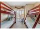 ' bedroom with two sets of bunk beds and a window offering natural light at 701 N Atlantic Ave # 203, New Smyrna Beach, FL 32169
