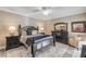 Spacious bedroom with a king-size bed, plenty of storage, and access to a balcony at 701 N Atlantic Ave # 203, New Smyrna Beach, FL 32169