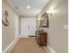 Bright condo entry with ornate console table at 701 N Atlantic Ave # 203, New Smyrna Beach, FL 32169