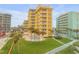 Building exterior, pool, landscaping, and ocean at 701 N Atlantic Ave # 203, New Smyrna Beach, FL 32169