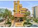 Attractive yellow building with ocean views and gated entrance at 701 N Atlantic Ave # 203, New Smyrna Beach, FL 32169