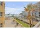 Ground level view of the ocean, pool and building at 701 N Atlantic Ave # 203, New Smyrna Beach, FL 32169