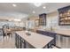 Open concept kitchen with a large island, stainless steel appliances, and ocean views at 701 N Atlantic Ave # 203, New Smyrna Beach, FL 32169