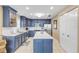 Modern kitchen with blue cabinets and quartz countertops at 701 N Atlantic Ave # 203, New Smyrna Beach, FL 32169