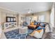 Spacious living room featuring a large sectional sofa and a flat-screen TV at 701 N Atlantic Ave # 203, New Smyrna Beach, FL 32169
