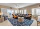 Spacious living room with L-shaped sectional sofa and ocean views at 701 N Atlantic Ave # 203, New Smyrna Beach, FL 32169