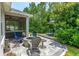 Stone patio with fire pit and comfortable seating at 758 Victory Ln, Port Orange, FL 32128