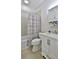 Bathroom with shower/tub, toilet, and white vanity at 801 Sandpiper Ave, New Smyrna Beach, FL 32169