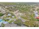 Aerial view of a house and surrounding neighborhood with lush vegetation at 804 Sandpiper Ave, New Smyrna Beach, FL 32169