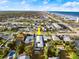 Aerial view of a residential property in a coastal town, with the ocean and buildings visible in the distance at 833 E 26Th Ave, New Smyrna Beach, FL 32169