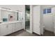 Modern bathroom with a double vanity, walk-in shower, and separate water closet at 833 E 26Th Ave, New Smyrna Beach, FL 32169