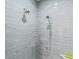 Modern walk-in shower with light blue subway tile and dual shower heads at 833 E 26Th Ave, New Smyrna Beach, FL 32169