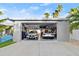 Two cars parked inside a spacious, organized garage at 833 E 26Th Ave, New Smyrna Beach, FL 32169