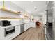 Well-appointed kitchen with stainless steel appliances and white cabinets at 833 E 26Th Ave, New Smyrna Beach, FL 32169