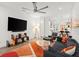 Inviting living room with a large TV, comfortable seating, and unique art pieces at 833 E 26Th Ave, New Smyrna Beach, FL 32169