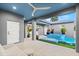 Covered patio with a ceiling fan and view of the pool at 833 E 26Th Ave, New Smyrna Beach, FL 32169