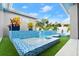 Tranquil pool area with blue tiled pool and lush landscaping at 833 E 26Th Ave, New Smyrna Beach, FL 32169