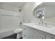 Modern bathroom with white vanity and quartz countertop at 886 Matthews Ave, New Smyrna Beach, FL 32169