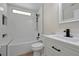 Modern bathroom with white subway tile, a bathtub, and black fixtures at 886 Matthews Ave, New Smyrna Beach, FL 32169