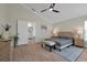 Spacious bedroom with ensuite bathroom access, featuring a king-size bed and neutral decor at 886 Matthews Ave, New Smyrna Beach, FL 32169