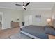 Bedroom with a king-size bed, dresser, and neutral color scheme at 886 Matthews Ave, New Smyrna Beach, FL 32169