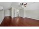 Large bedroom with hardwood floors and ensuite bathroom at 886 Matthews Ave, New Smyrna Beach, FL 32169