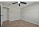 Simple bedroom with tile flooring and an interior door at 886 Matthews Ave, New Smyrna Beach, FL 32169