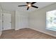 Bedroom featuring tile floors, a closet, and an interior door at 886 Matthews Ave, New Smyrna Beach, FL 32169