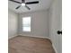 Spacious bedroom with tile floors and ceiling fan at 886 Matthews Ave, New Smyrna Beach, FL 32169