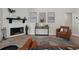 Modern fireplace with white tile surround and black mantel at 886 Matthews Ave, New Smyrna Beach, FL 32169