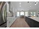 Open concept kitchen boasting stainless steel appliances and a large island at 886 Matthews Ave, New Smyrna Beach, FL 32169