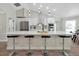 Modern kitchen featuring stainless steel appliances and a large island with seating at 886 Matthews Ave, New Smyrna Beach, FL 32169