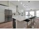 Updated kitchen with stainless steel appliances and an expansive island at 886 Matthews Ave, New Smyrna Beach, FL 32169
