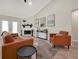 Spacious living room with a fireplace and comfortable seating at 886 Matthews Ave, New Smyrna Beach, FL 32169
