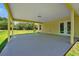 Covered patio with access from the house and backyard at 886 Matthews Ave, New Smyrna Beach, FL 32169