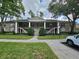 Two-story building exterior with manicured lawn and parking at 112 Reserve Cir # 104, Oviedo, FL 32765
