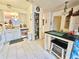 Kitchen with island, pantry, and white cabinets at 112 Reserve Cir # 104, Oviedo, FL 32765