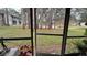 Screened patio with view of a pond and lush landscaping at 112 Reserve Cir # 104, Oviedo, FL 32765