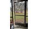 Screened patio with view of grassy area and trees at 112 Reserve Cir # 104, Oviedo, FL 32765