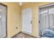 Condo entryway with white door and tile floor at 116 Cedar Dunes Dr, New Smyrna Beach, FL 32169