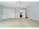 Bright bedroom with access to bathroom and carpet flooring at 1975 Spruce Creek Cir, Port Orange, FL 32128