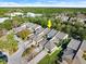 Aerial view of a townhome community, highlighting a specific property's location and surrounding landscape at 210 Victoria Commons Blvd, Deland, FL 32724