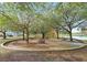 Circular picnic area with tables under large shade trees at 210 Victoria Commons Blvd, Deland, FL 32724