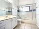 Clean bathroom with a shower/tub combo and white vanity at 216 Ocean Dr, New Smyrna Beach, FL 32169
