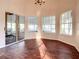 Bright breakfast room with wood floors and sliding glass doors leading to the pool at 216 Ocean Dr, New Smyrna Beach, FL 32169