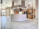 Large kitchen with an island, stainless steel appliances, and wood cabinets at 216 Ocean Dr, New Smyrna Beach, FL 32169