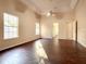 Spacious main bedroom with wood flooring and lots of natural light at 216 Ocean Dr, New Smyrna Beach, FL 32169