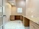 Home office with built-in desk and granite countertop at 216 Ocean Dr, New Smyrna Beach, FL 32169