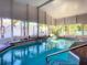 Inviting in-ground pool with spa and plenty of natural light at 216 Ocean Dr, New Smyrna Beach, FL 32169